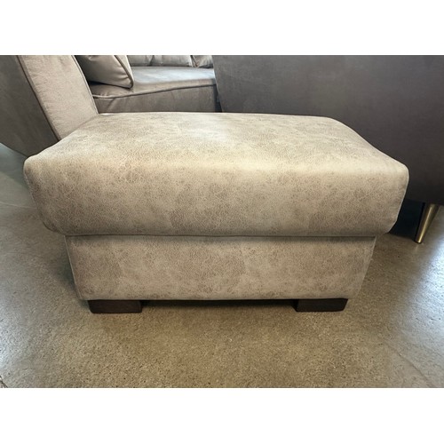 1329 - A stone Alcantara footstool, brand new