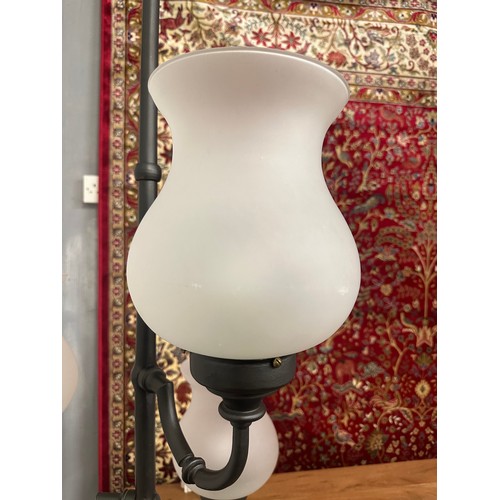 1359 - An industrial style three light floor lamp