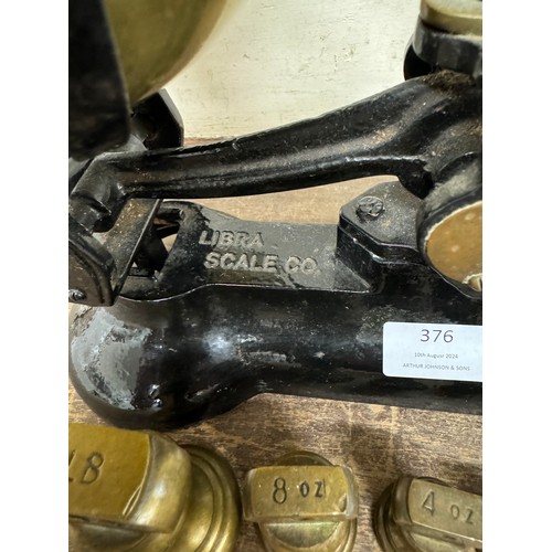 376 - A Libra Scale Co. scales with graduated brass weights