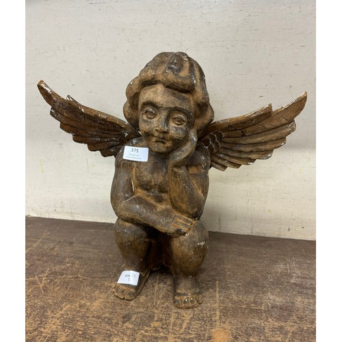 375 - A French carved wood cherub