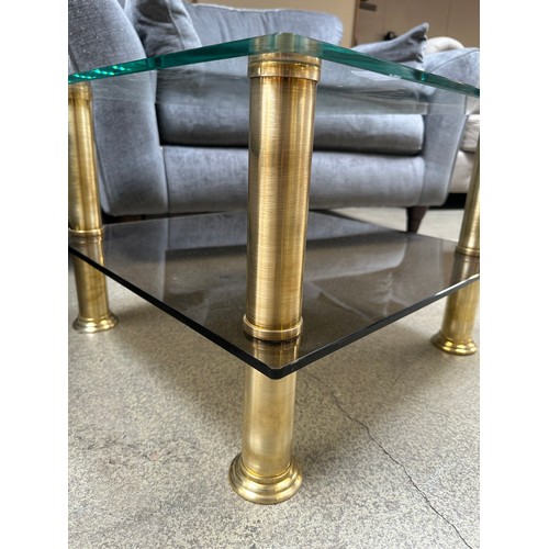 1543 - A coffee table with brushed brass legs and tempered glass