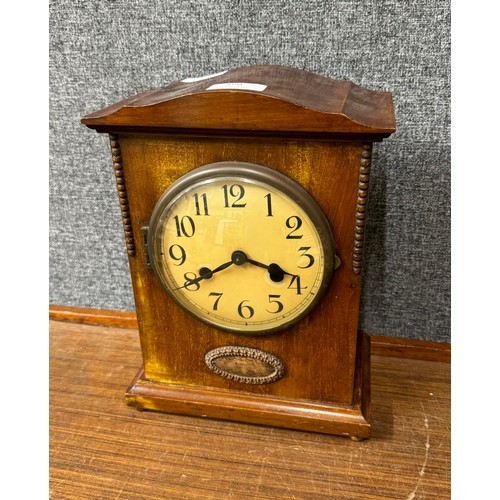 360 - An early 20th Century walnut cased mantle clock