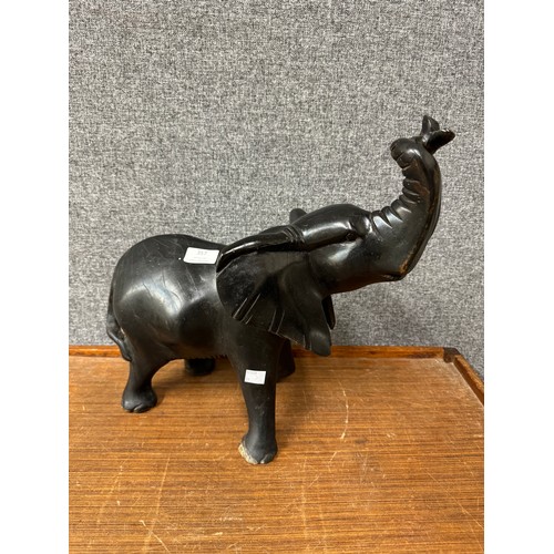 357 - An African carved ebonised figure of an elephant