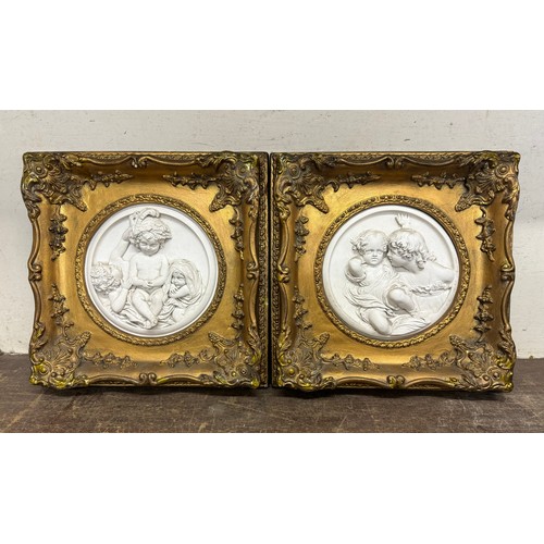 355 - A pair of Italian style marble effect plaques, in gilt frames