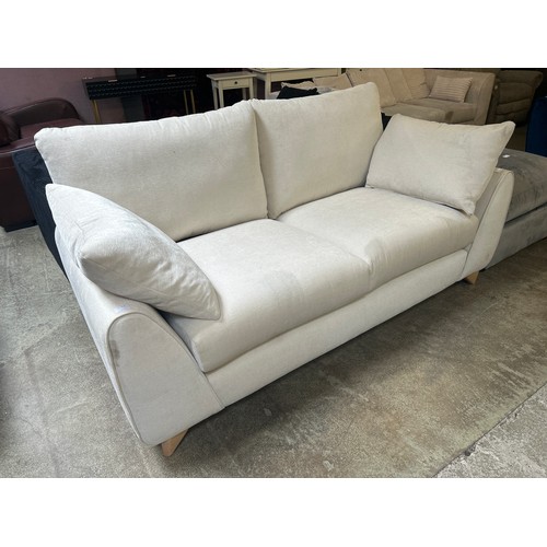 1519A - An ivory velvet 2.5 seater sofa - Brand new - marked and scuffed