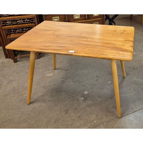 93K - An Ercol Blonde elm and beech 393 model low breakfast table