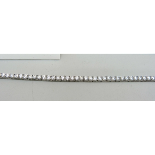 1004 - A silver and moissanite tennis bracelet, with certificate, 15cm