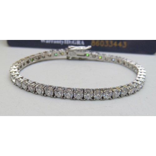 1004 - A silver and moissanite tennis bracelet, with certificate, 15cm