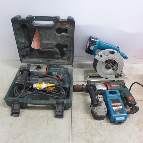 2009 - A quantity of power tools including a Metabo KHE-2443, 110V hammer drill, a Makita 5621RD power saw,... 