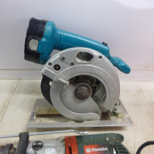 2009 - A quantity of power tools including a Metabo KHE-2443, 110V hammer drill, a Makita 5621RD power saw,... 