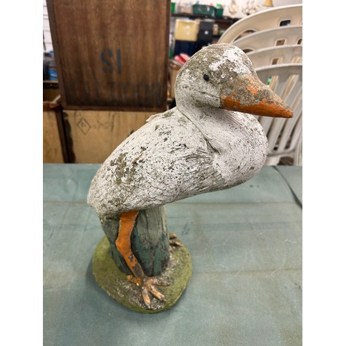 2158 - 2 duck garden ornaments including a duck on a log and one other