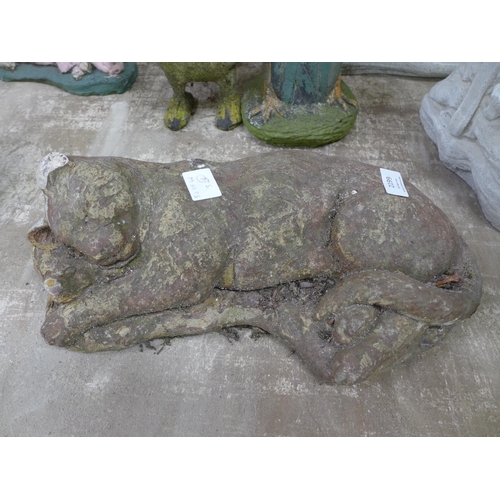 2162 - Concrete garden ornaments including a sleeping cat, a sleeping fox, a dog and a cast metal cat in a ... 