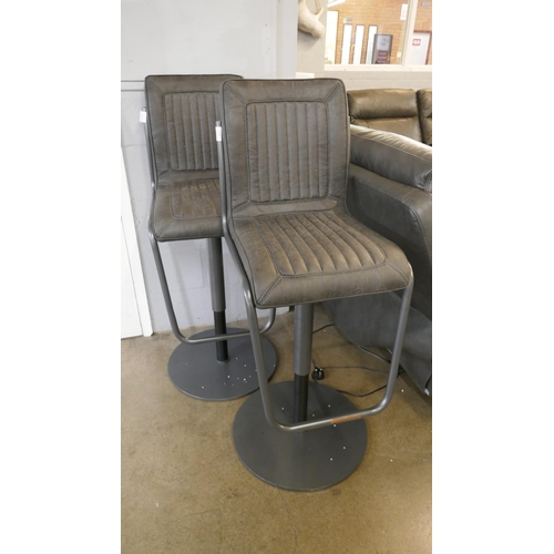 1323 - A pair of industrial style gas lift bar stools  * This lot is subject to VAT