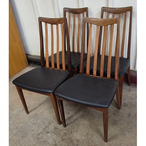 7 - A set of four G-Plan Fresco teak and black vinyl dining chairs