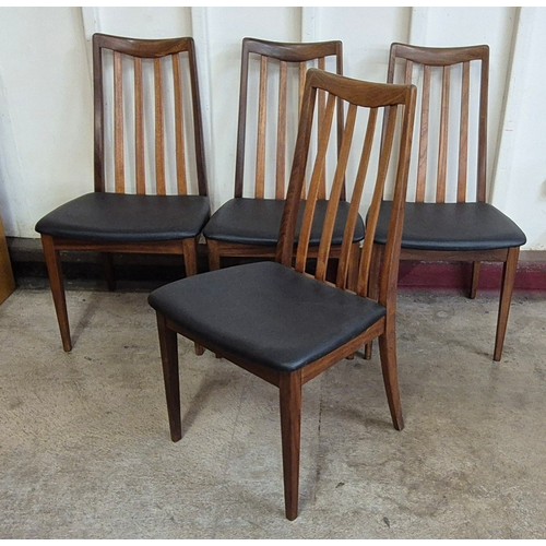 7 - A set of four G-Plan Fresco teak and black vinyl dining chairs