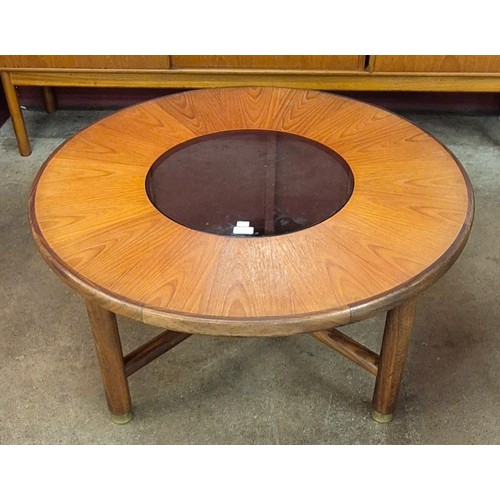 12 - A G-Plan circular teak and glass topped coffee table