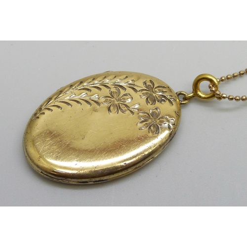 1006 - A silver gilt locket on a chain