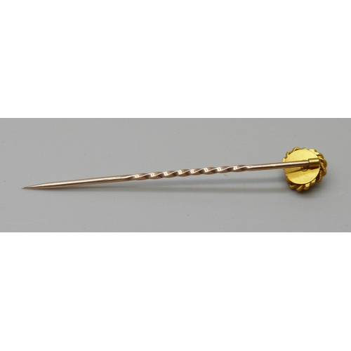 1008 - A diamond set stick pin, marked 15ct, in a fitted case, 1.5g