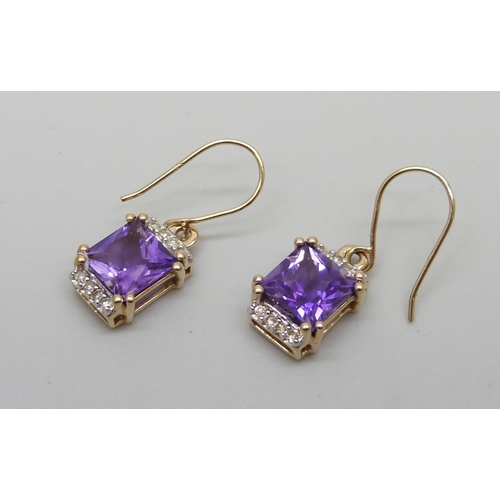 1009 - A pair of 10kt gold, amethyst and diamond earrings, 2.5g