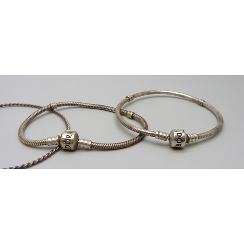 1010 - A hallmarked silver bangle, 18g, two Pandora bracelets and a rope twist bangle