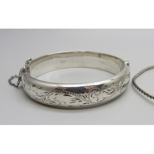 1010 - A hallmarked silver bangle, 18g, two Pandora bracelets and a rope twist bangle