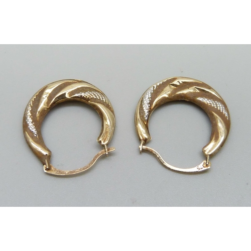 1013 - A pair of 9ct gold hoop earrings, 0.8g