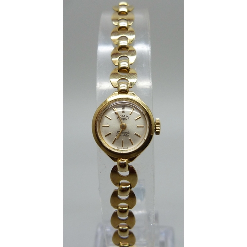 1023 - A lady's 9ct gold Rotary wristwatch on a 9ct gold Mariner link strap, 8.7g of gold