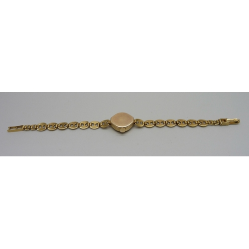 1023 - A lady's 9ct gold Rotary wristwatch on a 9ct gold Mariner link strap, 8.7g of gold