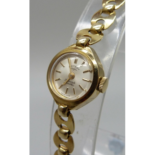 1023 - A lady's 9ct gold Rotary wristwatch on a 9ct gold Mariner link strap, 8.7g of gold