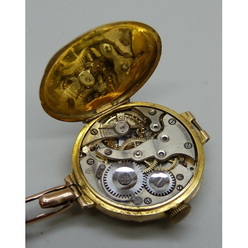 1024 - Two lady's 9ct gold cased wristwatches, one Omega with enamel dial, movement numbered 7603296, the o... 