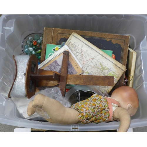 1052 - Two boxes of assorted items, doll, maps, 19th century scrap album, marbles, playing cards, field gla... 