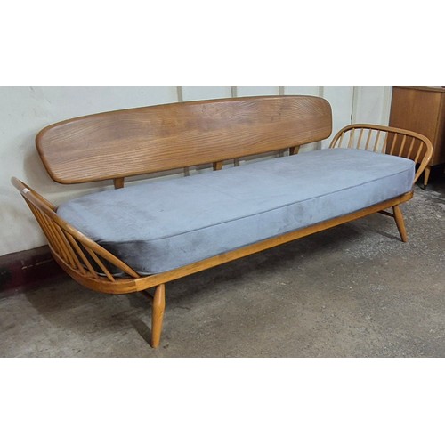 15 - An Ercol Blonde elm and beech 355 model studio couch. Please note this lot is being sold as a work o... 