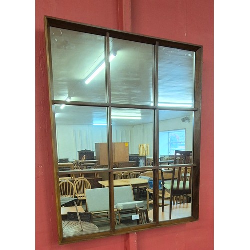 13 - A teak panelled framed mirror