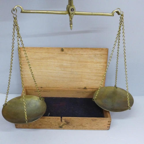 614 - A cased set of balance scales and weights