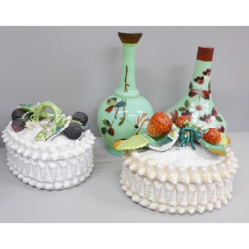 619 - Two ceramic baskets of fruit, both a/f and two opaline green glass vases