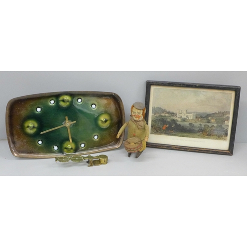 622 - A Schuco clockwork toy, a brass sovereign balance, an enamelled clock and a Southwell, Nottinghamshi... 