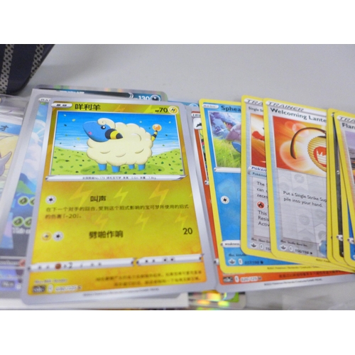 643 - A collection of Pokemon cards including V, holographic, Japanese cards, etc.