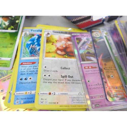 643 - A collection of Pokemon cards including V, holographic, Japanese cards, etc.