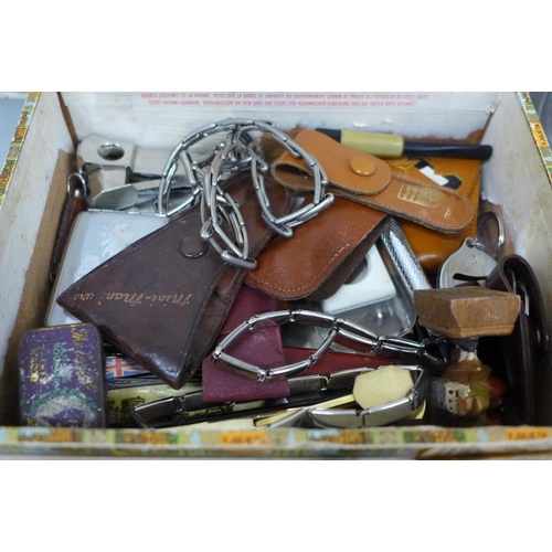 649 - Assorted items including bottle opener, wine stopper, tins, pen knives, cigar cutter, etc.