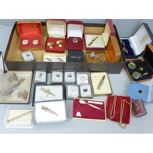 657 - A collection of tie pins, cufflinks and sets