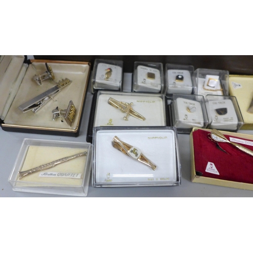 657 - A collection of tie pins, cufflinks and sets