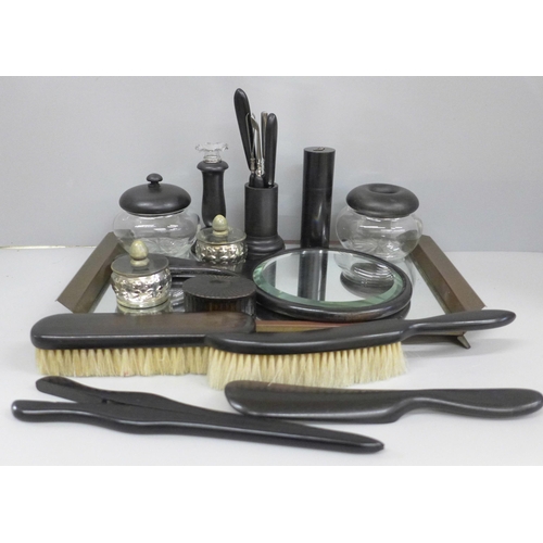 666 - An ebony dressing table set and other similar items