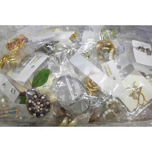 674 - A collection of new costume earrings and brooches