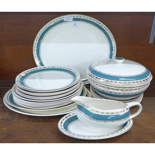 685 - A Crown Ducal dinner service, six setting including serving plates, gravy boat and a pair of tureens... 