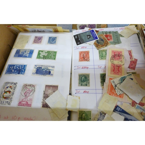 688 - A box of loose stamps, first day covers and a set of Ukraine stamps