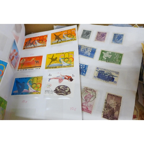 688 - A box of loose stamps, first day covers and a set of Ukraine stamps