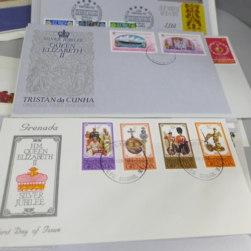 688 - A box of loose stamps, first day covers and a set of Ukraine stamps