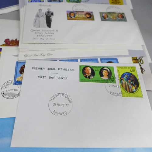 688 - A box of loose stamps, first day covers and a set of Ukraine stamps