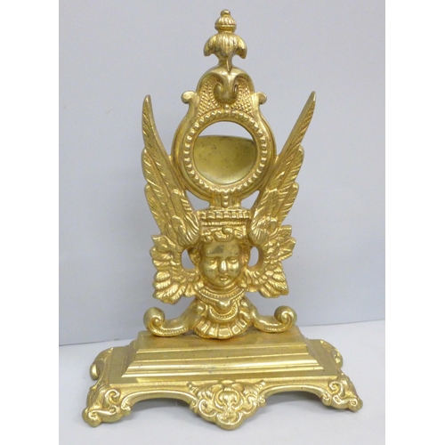 700 - A brass clock stand, model of a dog, boxes, lighter, etc.