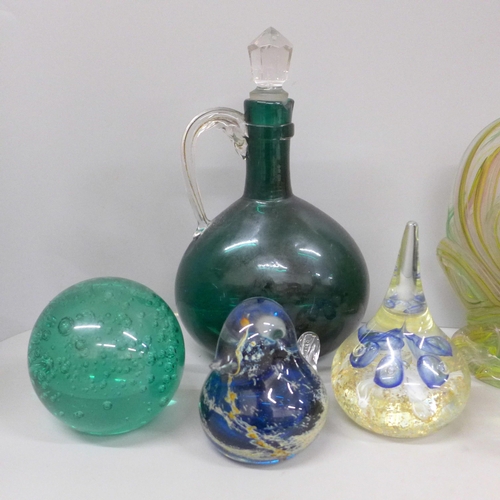 702 - A collection of glass paperweights including two Mdina birds, green glass flask and a Swaziland glas... 